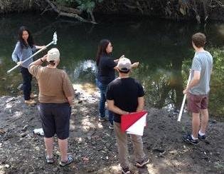 new recruits learning to take a water sample Merri Creek Northcote