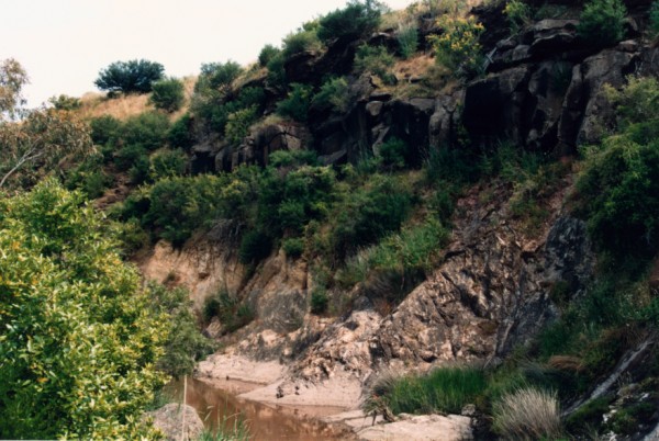 Basalt/Silurian unconformity on Merri Creek at Galada Tamboore, Campbellfield, Victoria, Australia